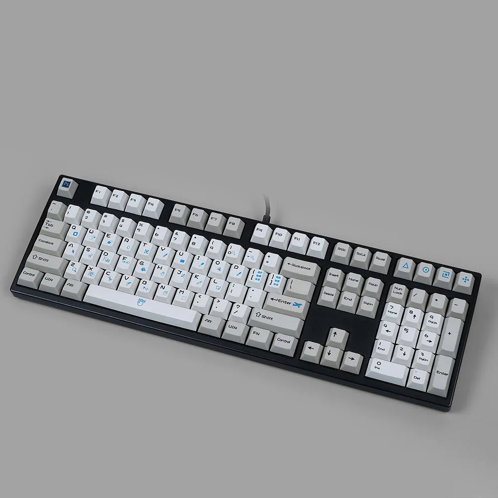 PlayStation-themed mechanical keyboard keycaps in blue and white or gray and white colour schemes
