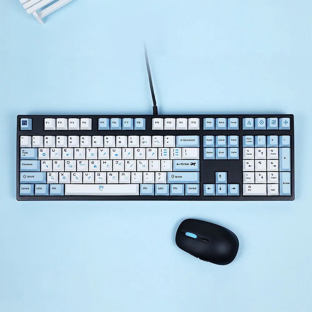 PlayStation-themed mechanical keyboard keycaps in blue and white or gray and white colour schemes
