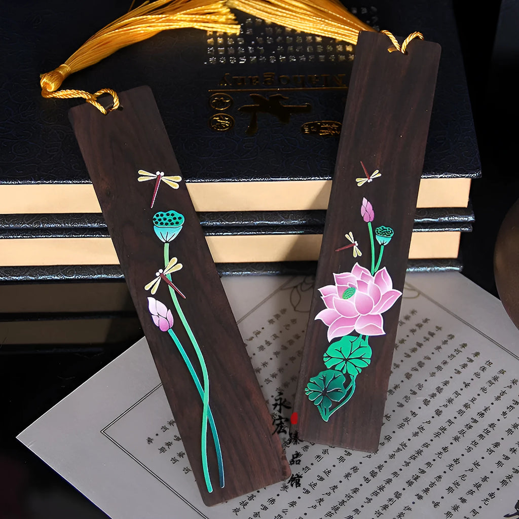 Chinese style painted lotus bookmark made from sandalwood with landscape flower decoration.