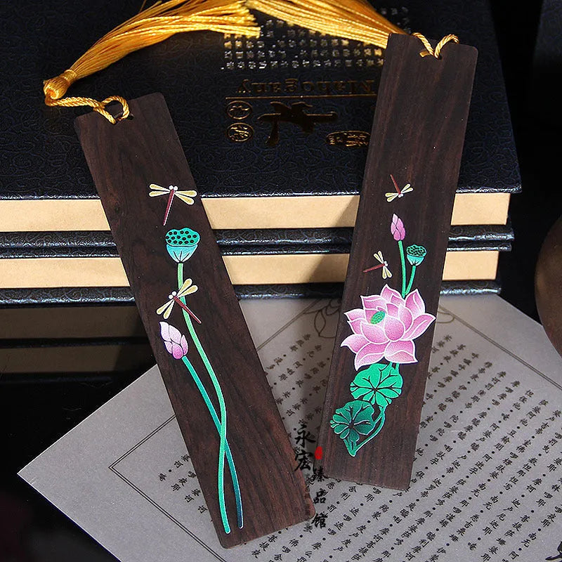 Chinese style painted lotus bookmark made from sandalwood with landscape flower decoration.