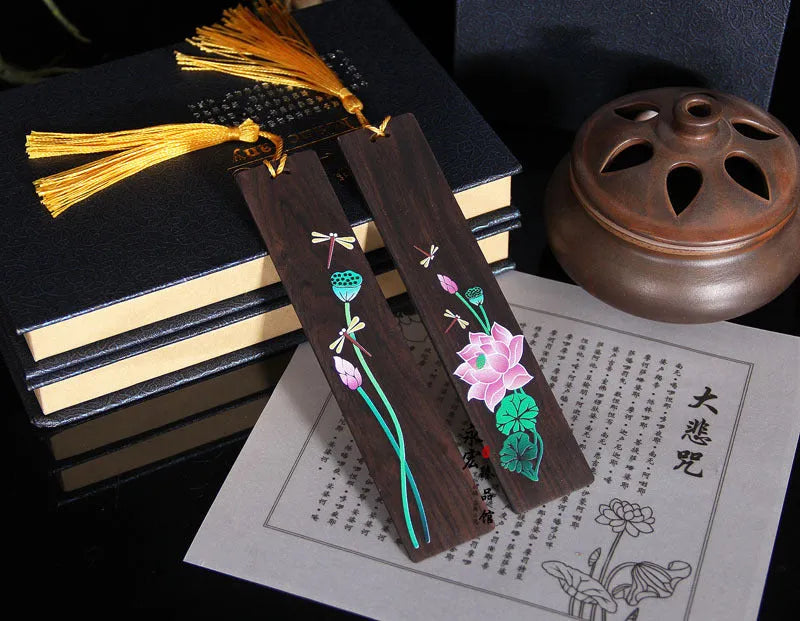 Chinese style painted lotus bookmark made from sandalwood with landscape flower decoration.