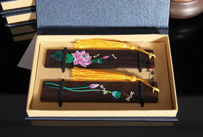 Chinese style painted lotus bookmark made from sandalwood with landscape flower decoration.