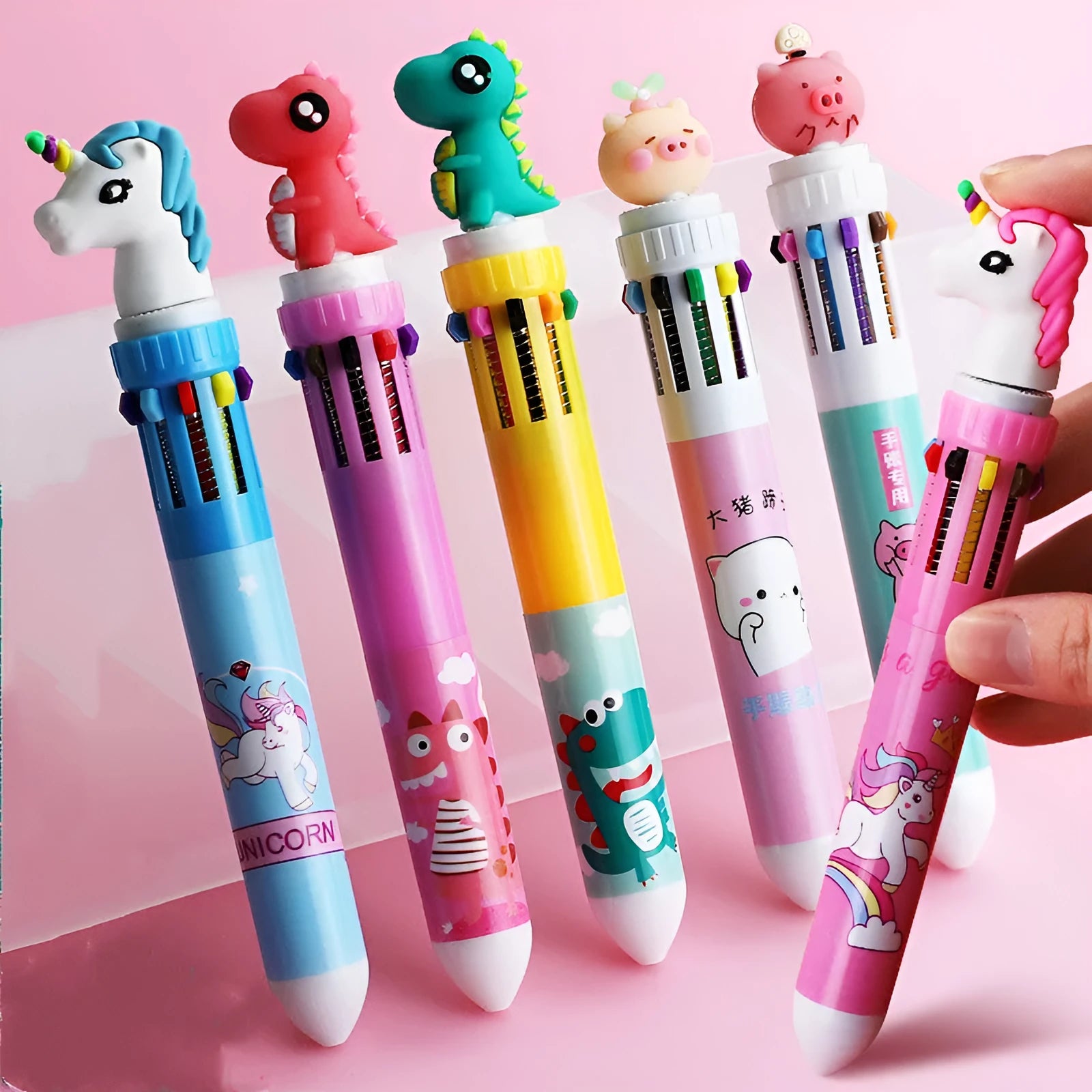 Cartoon-themed ballpoint pen showing ten colour options including red, blue, and green with a 0.5mm tip.
