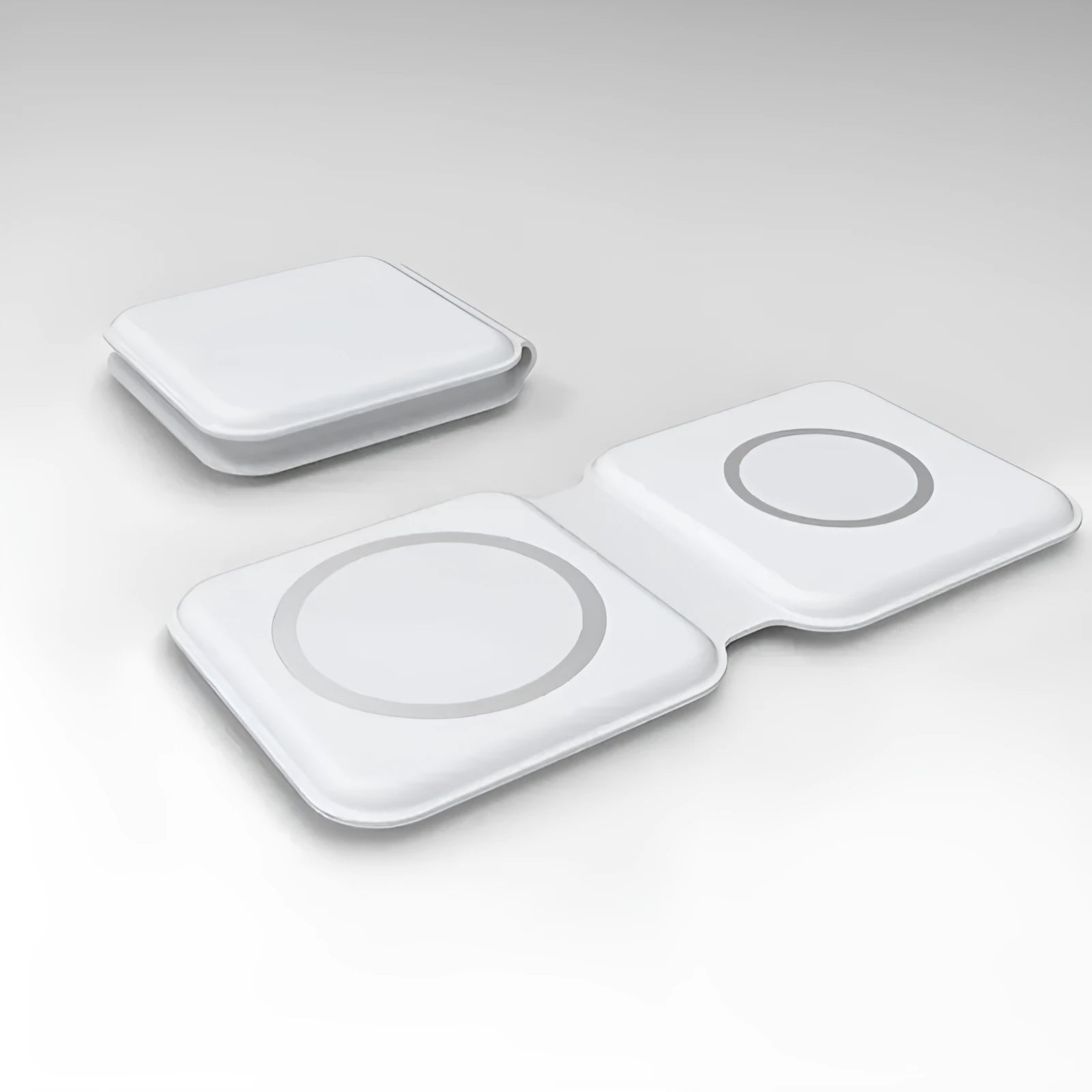 White foldable dual-pad magnetic wireless charging dock shown at an angle on a table.