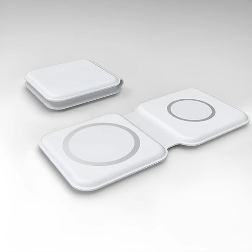 White foldable dual-pad magnetic wireless charging dock shown at an angle on a table.