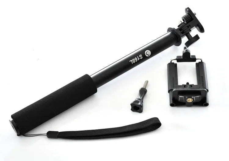 Black aluminium alloy selfie stick extended to full length with phone attached, showing tripod foot base.