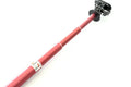 Black aluminium alloy selfie stick extended to full length with phone attached, showing tripod foot base.