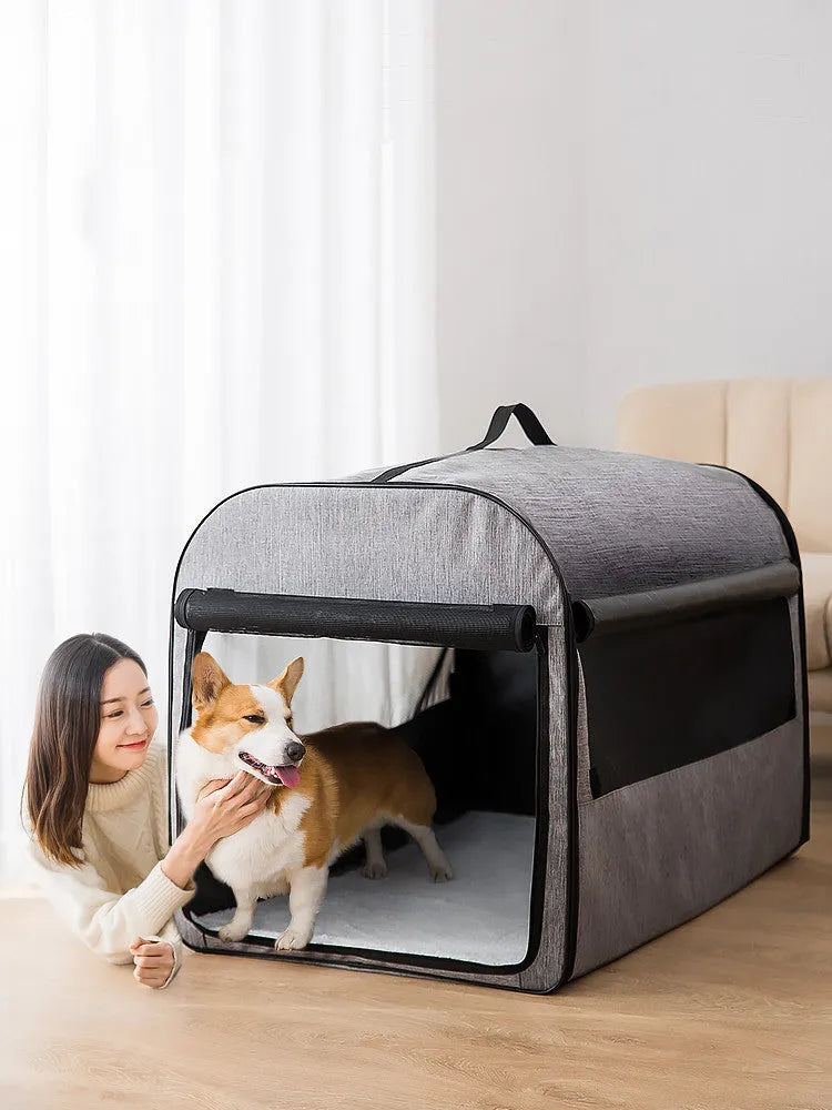 Grey portable dog cage house with mesh panels and roll-up sunshade for travel