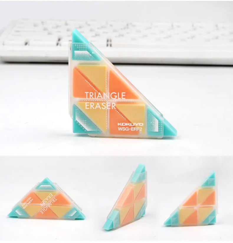 A blue PVC triangle eraser on a wooden desk, showing its three sharp corners for detail work.