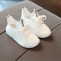 Mesh girls primary school sneakers in white with front tie laces and rubber sole