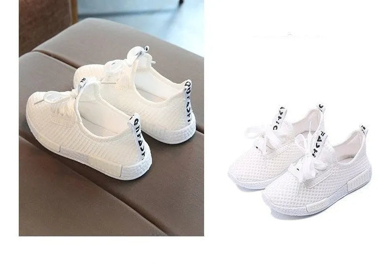 Mesh girls primary school sneakers in white with front tie laces and rubber sole