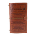 Leather hand ledger notebook with strap binding showing warm brown acid-free paper