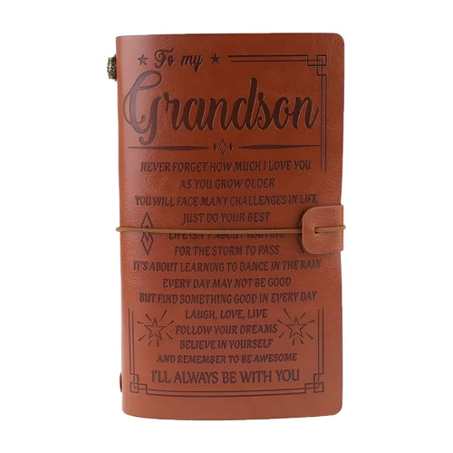 Leather hand ledger notebook with strap binding showing warm brown acid-free paper