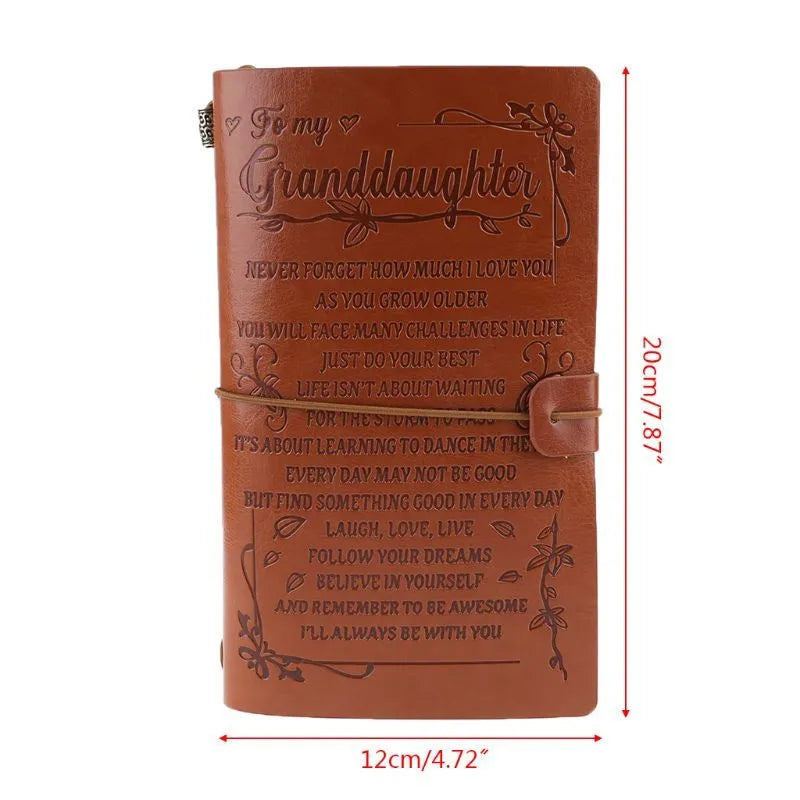 Leather hand ledger notebook with strap binding showing warm brown acid-free paper