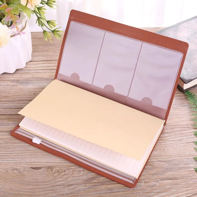 Leather hand ledger notebook with strap binding showing warm brown acid-free paper