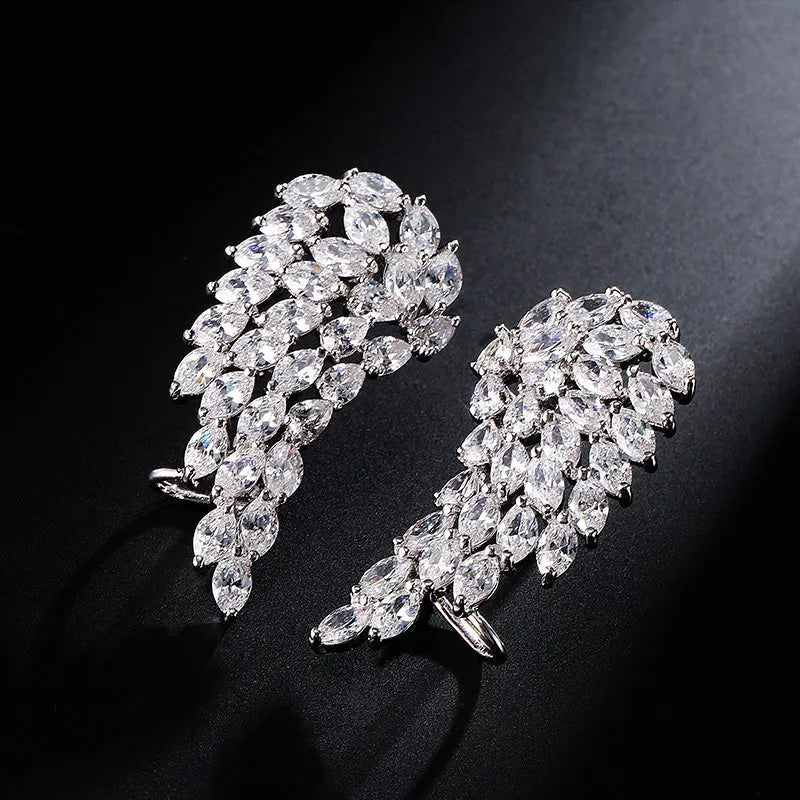 AAA cubic zirconia angel wing stud earrings in white gold colour with geometric design