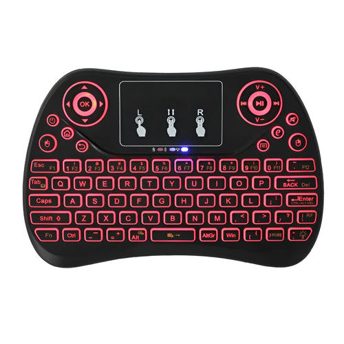 White mini wireless keyboard with colourful backlit keys and included flying squirrel mouse on a desk