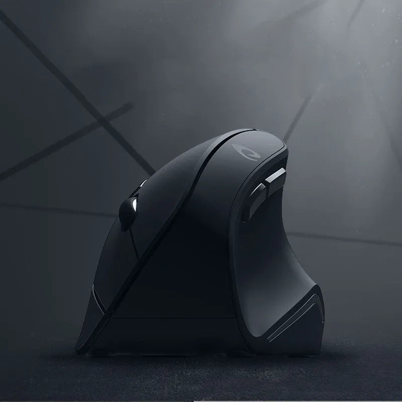 Black vertical ergonomic wireless mouse with 2.4G USB receiver on a desk