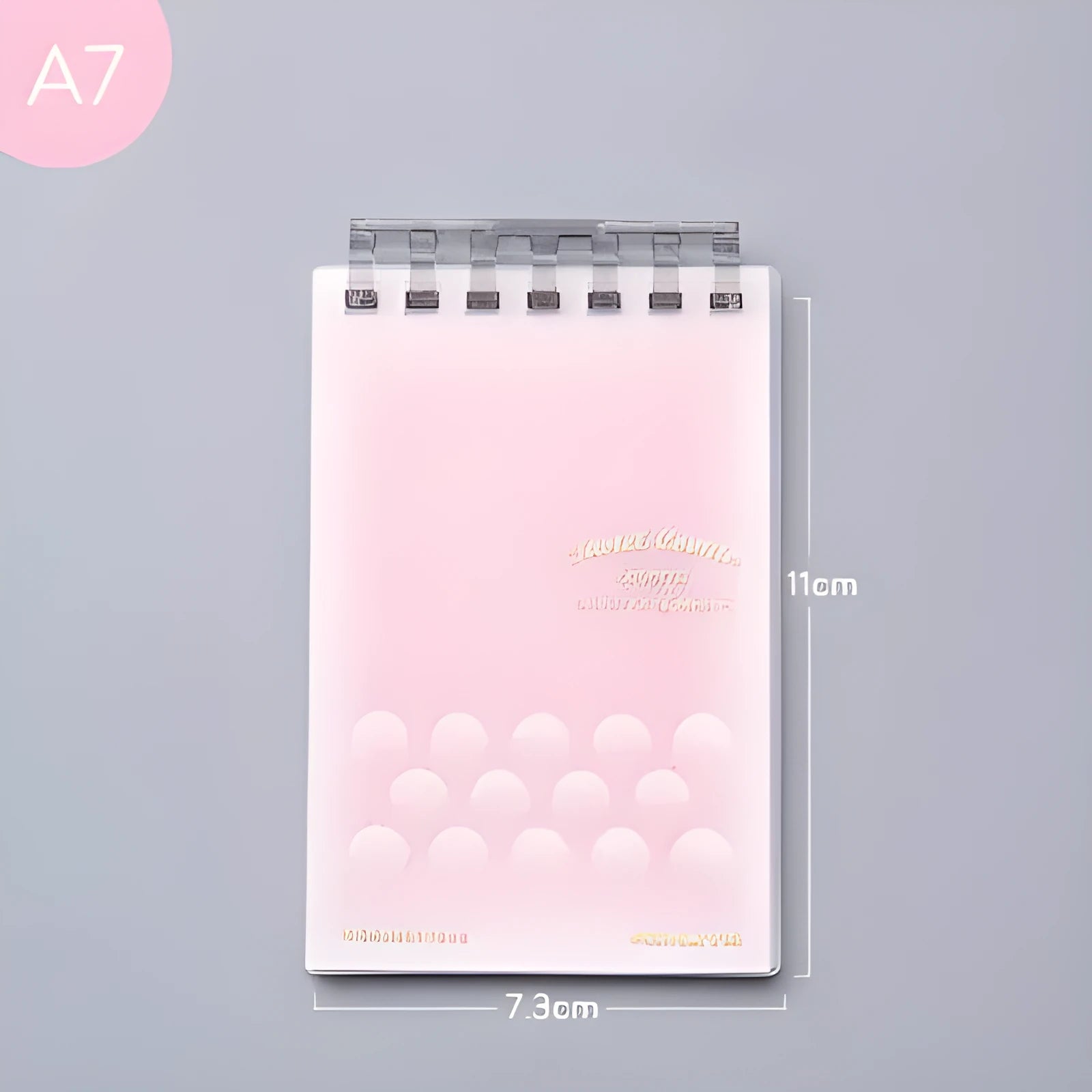 A7 detachable coil notebook with hard cover showing multiple loose-leaf paper types including timeline, checkered and blank formats