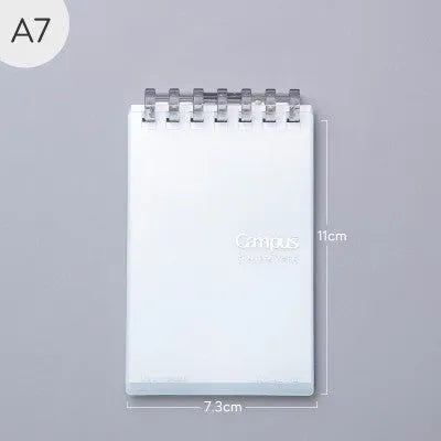 A7 detachable coil notebook with hard cover showing multiple loose-leaf paper types including timeline, checkered and blank formats