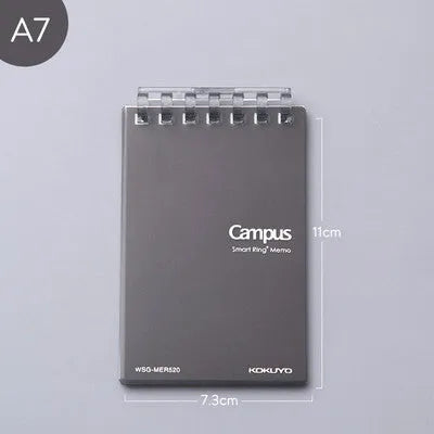 A7 detachable coil notebook with hard cover showing multiple loose-leaf paper types including timeline, checkered and blank formats