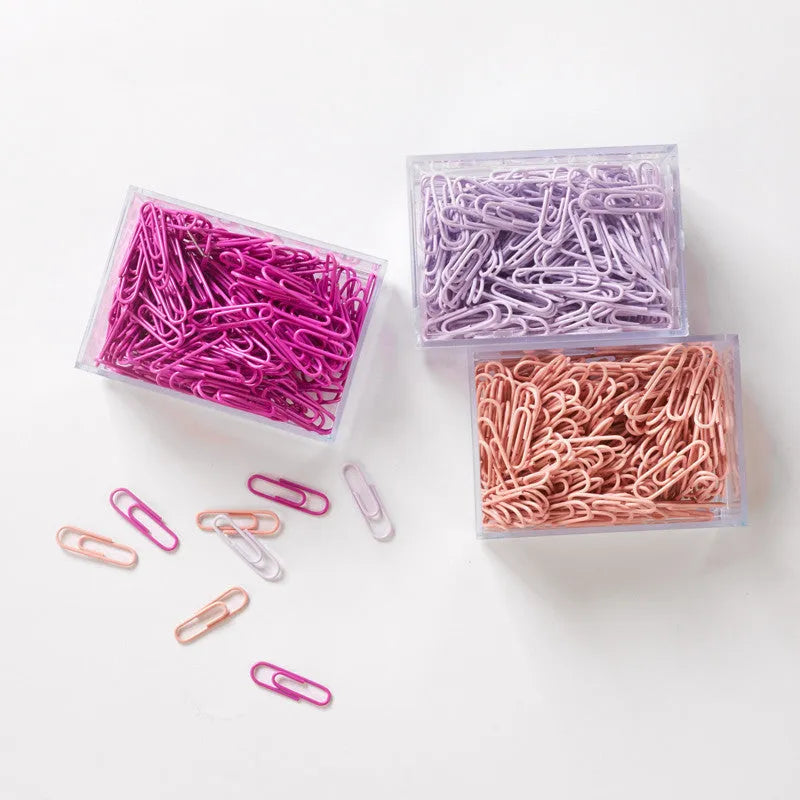 Mint green PVC coated metal paper clips 28mm and 50mm in office packaging