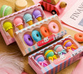 Set of 12 cartoon food erasers including ice creams, donuts, and lollipops for children.