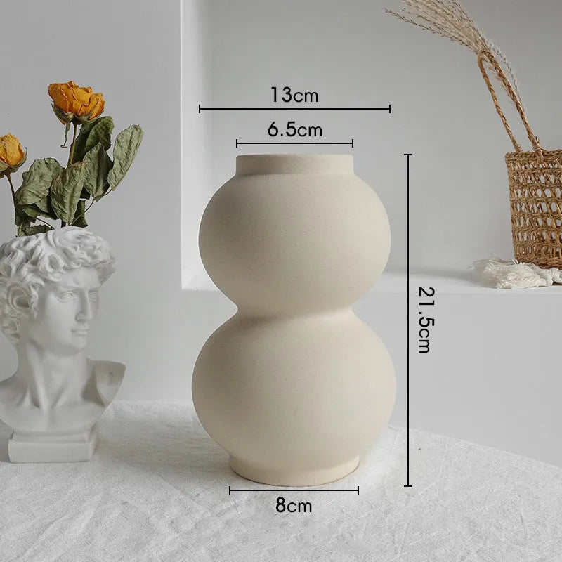 Matte ceramic dry flower vase with textured unglazed surface in Nordic design style