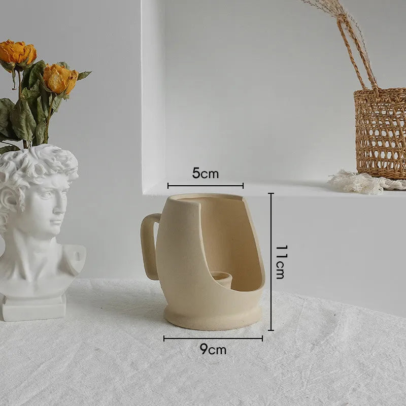 Matte ceramic dry flower vase with textured unglazed surface in Nordic design style