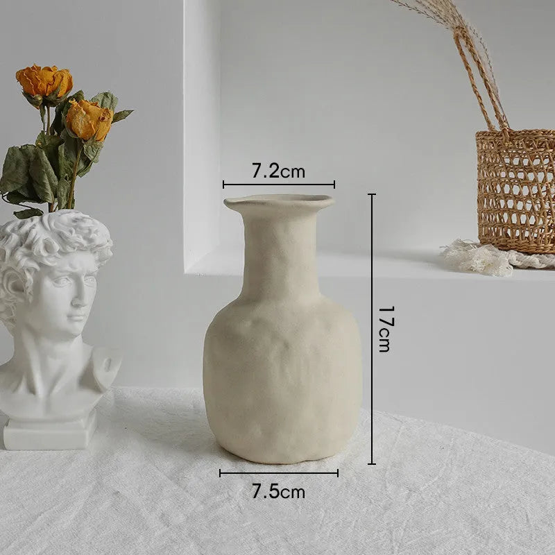 Matte ceramic dry flower vase with textured unglazed surface in Nordic design style