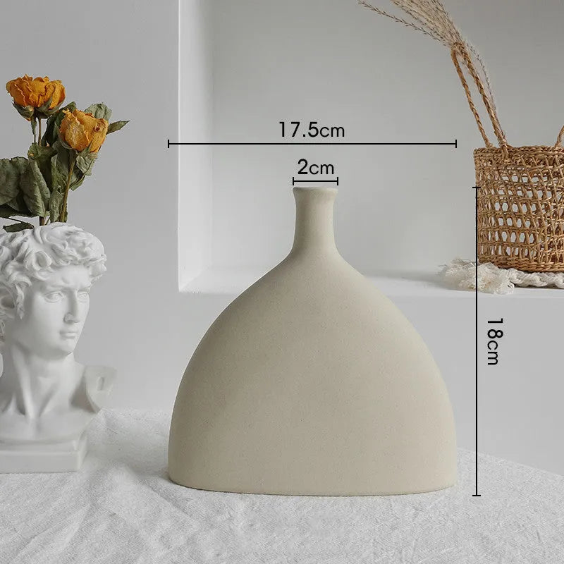 Matte ceramic dry flower vase with textured unglazed surface in Nordic design style