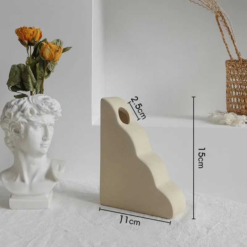 Matte ceramic dry flower vase with textured unglazed surface in Nordic design style