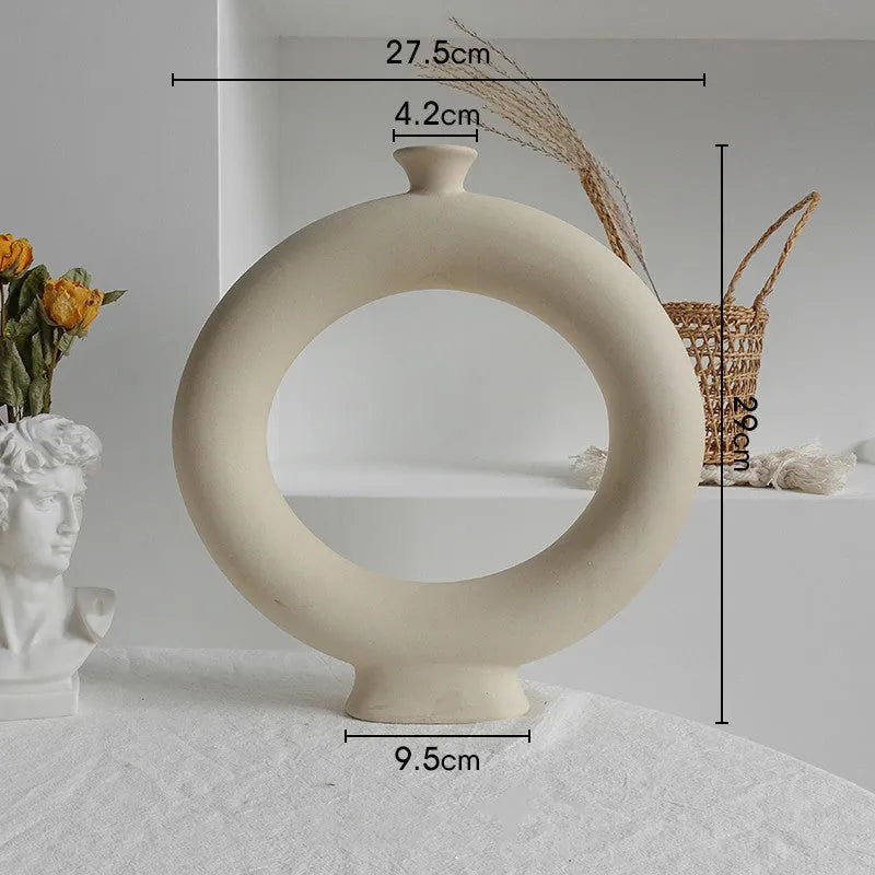 Matte ceramic dry flower vase with textured unglazed surface in Nordic design style