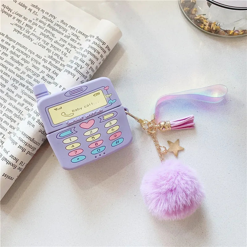 Purple silicone case for Apple AirPods with fur ball pendant showing clamshell design