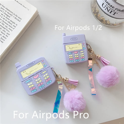 Purple silicone case for Apple AirPods with fur ball pendant showing clamshell design