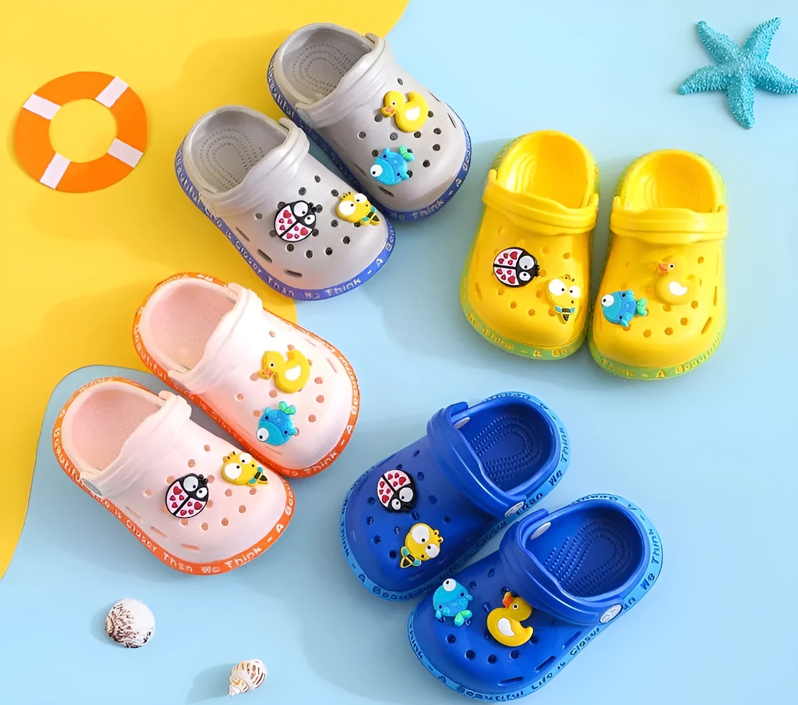 PVC toddler slippers with cartoon animal prints in yellow, blue, pink colours