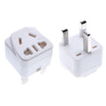 Square white and black international power adapter with five sockets and a three-pin plug.