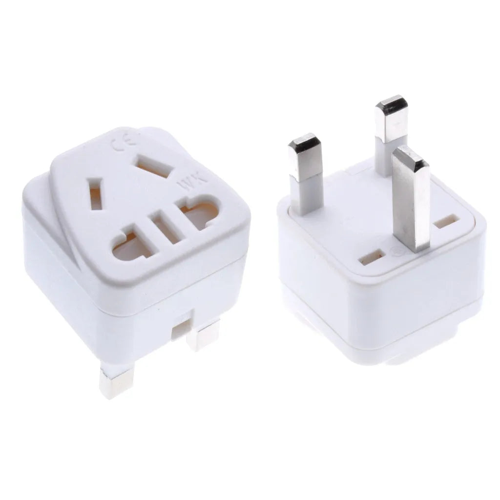 Square white and black international power adapter with five sockets and a three-pin plug.