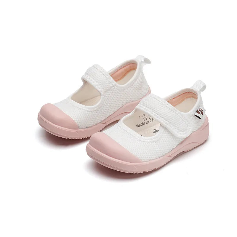White children's cloth shoes with mesh uppers and velcro fastening for toddler boys and girls