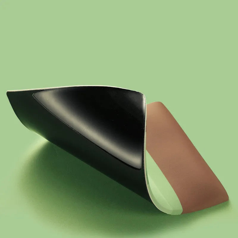 A kiwi-shaped mouse pad with a raised 20 mm thick wrist support section, shown in the colour as displayed.