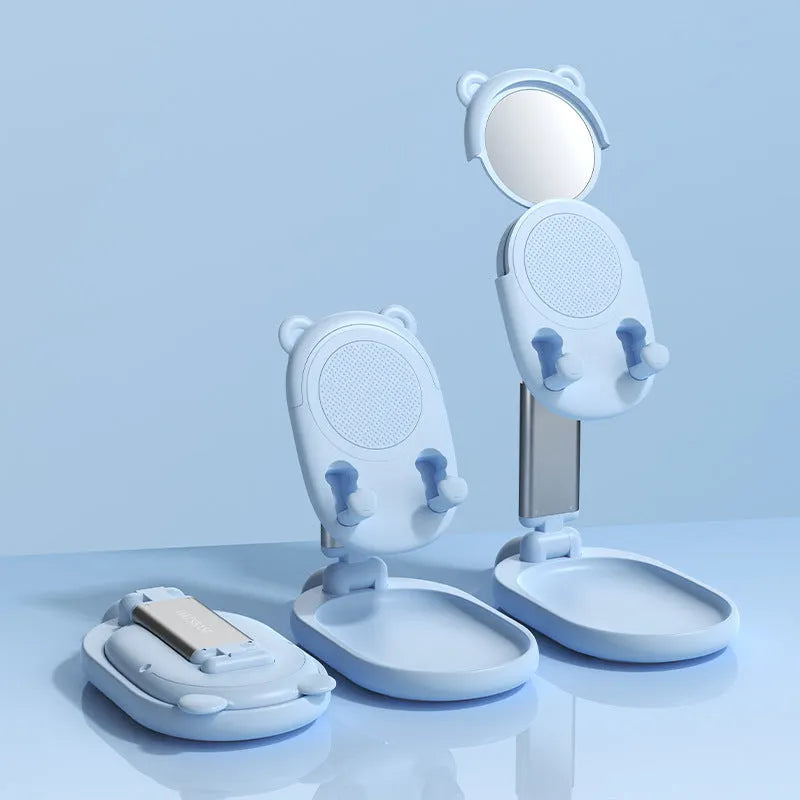 Blue adjustable desk phone and tablet stand with integrated mirror and non-slip silicone base.