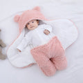 A baby quilted sleeping bag wrapper in a plain colour, showing its quilted pattern and soft cotton blend fabric.