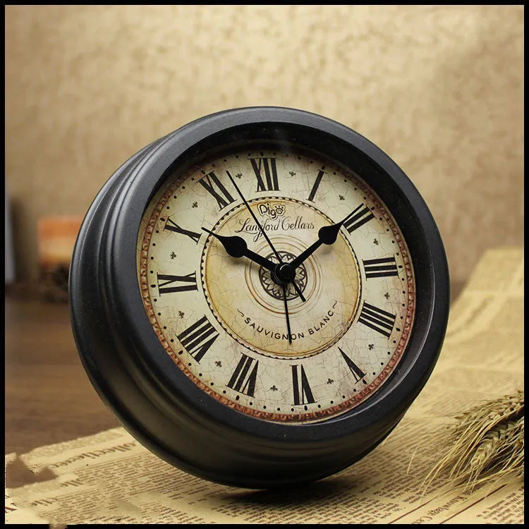 Round 6-inch retro-style desk alarm clock with silent sweep movement in a vintage colour on a wooden surface.