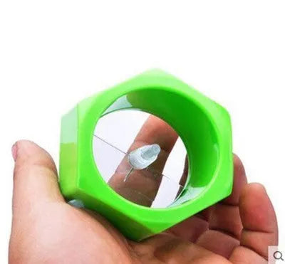 Yellow and green ABS plastic spiral vegetable cutter for slicing cucumbers.