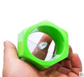 Yellow and green plastic spiral vegetable cutter on kitchen counter