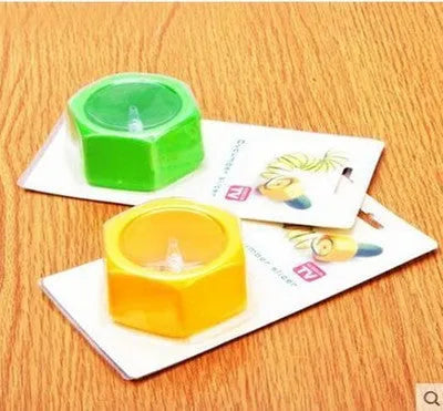 Yellow and green plastic spiral vegetable cutter on kitchen counter
