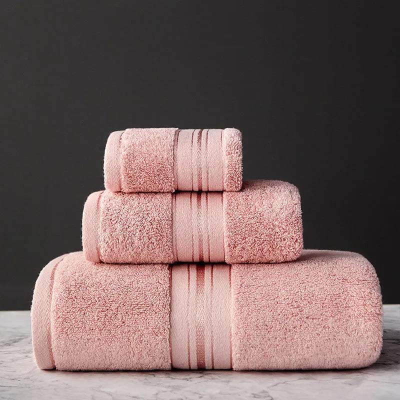 Three-piece cotton bath towel set in floral colours showing bath towel, hand towel and face cloth with optional logo printing