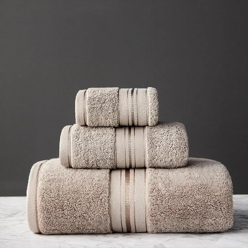 Three-piece cotton bath towel set in floral colours showing bath towel, hand towel and face cloth with optional logo printing