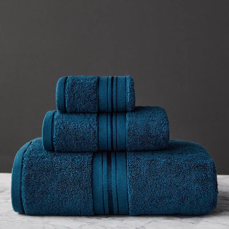 Three-piece cotton bath towel set in floral colours showing bath towel, hand towel and face cloth with optional logo printing