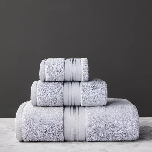 Three-piece cotton bath towel set in floral colours showing bath towel, hand towel and face cloth with optional logo printing